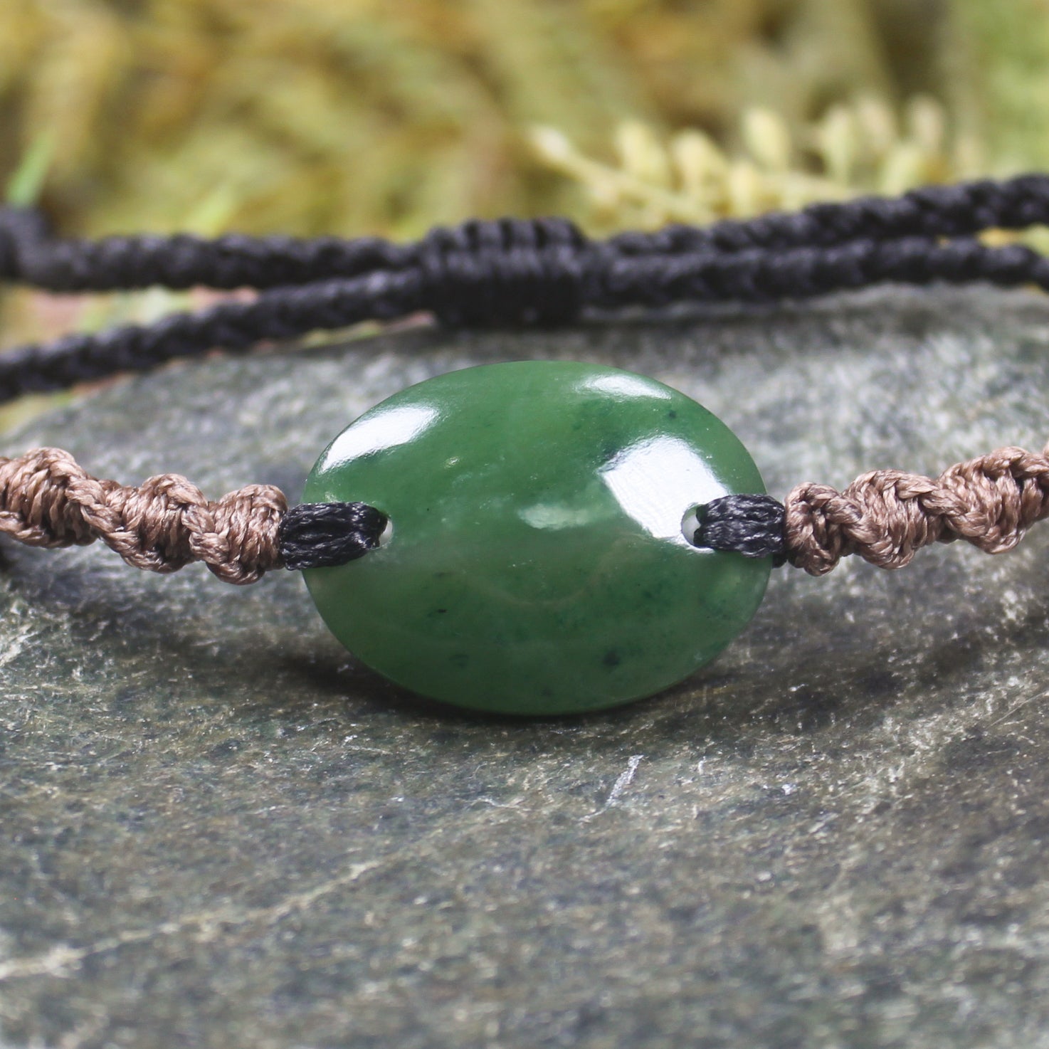 Adjustable cord bracelet with Kawakawa Pounamu