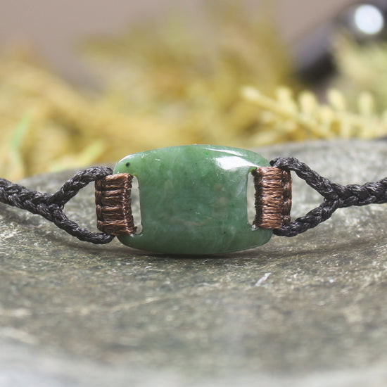 Adjustable cord bracelet with Hapopo Pounamu