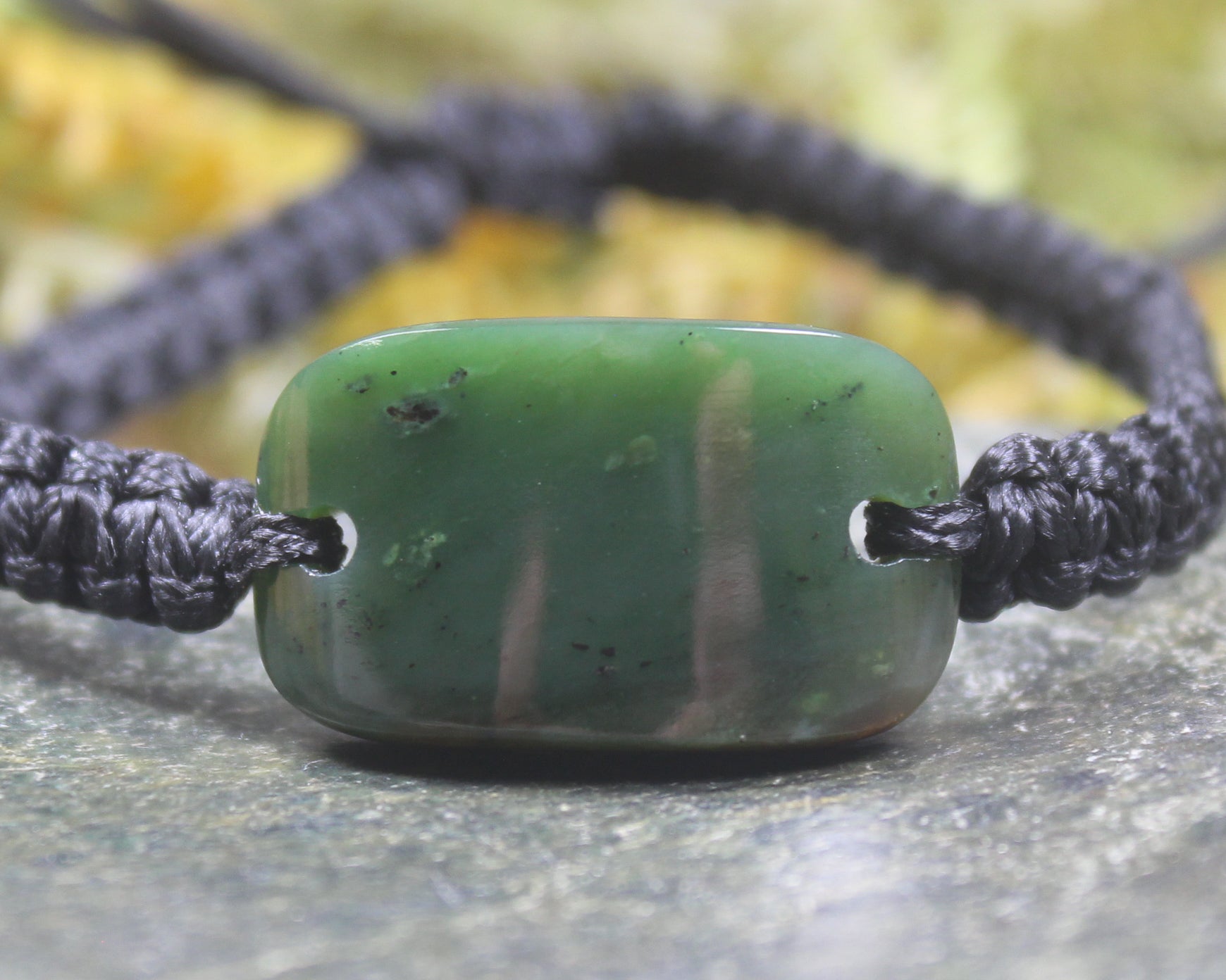 Adjustable cord bracelet with Kawakawa Pounamu