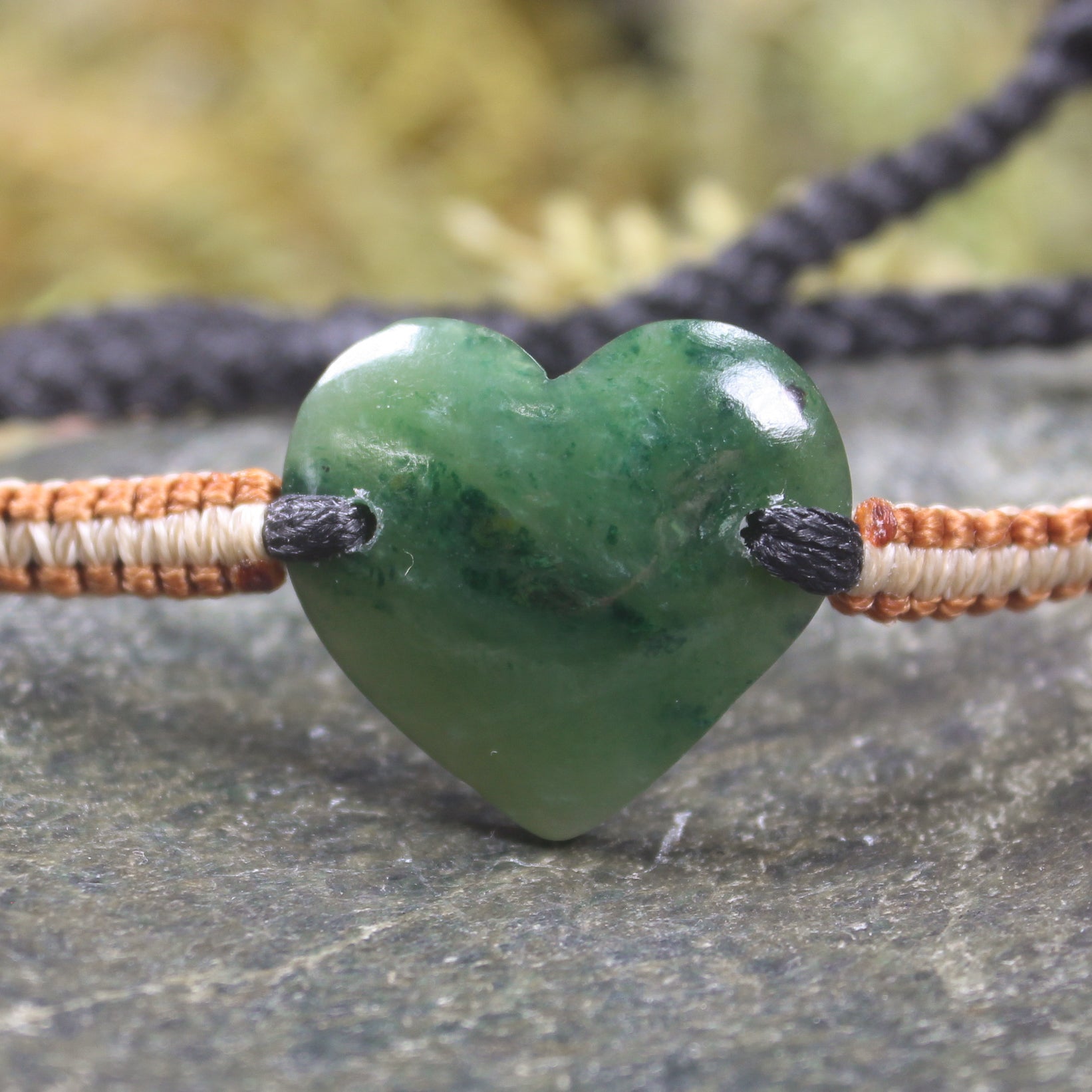 Adjustable cord bracelet with Kawakawa Pounamu