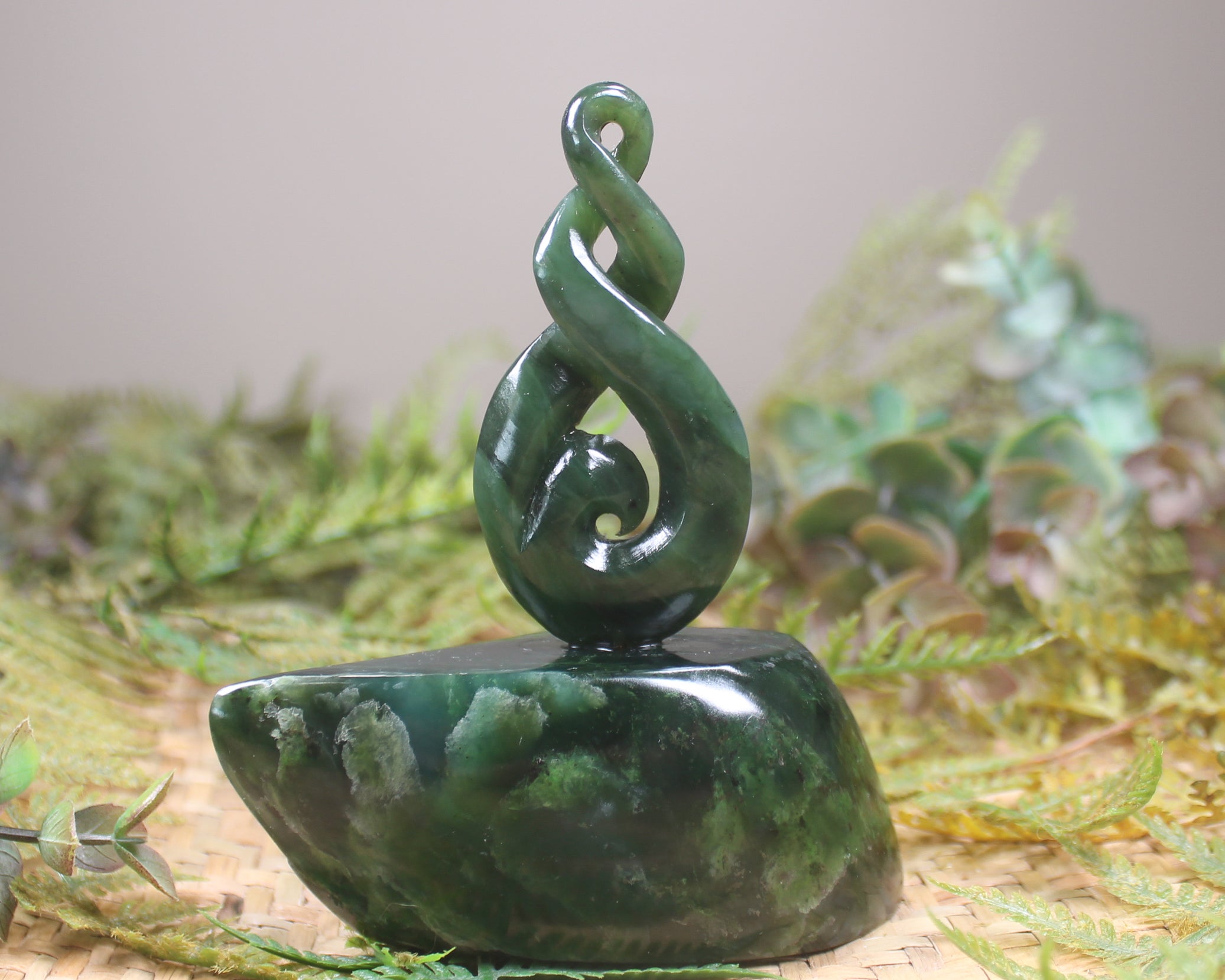 Kawakawa Pounamu Koru Twist set on a Pounamu base - NZ Greenstone