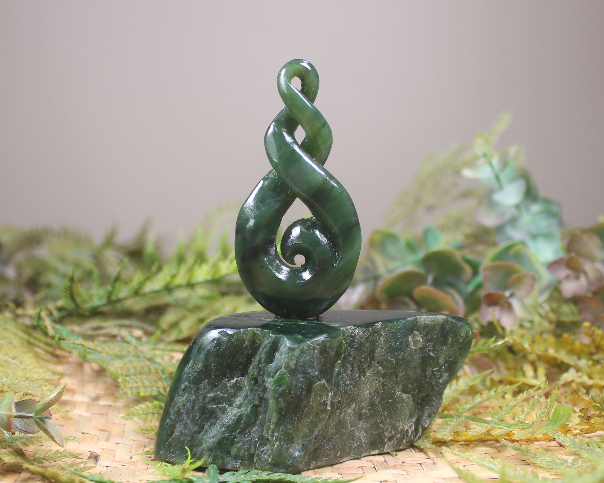 Kawakawa Pounamu Koru Twist set on a Pounamu base - NZ Greenstone