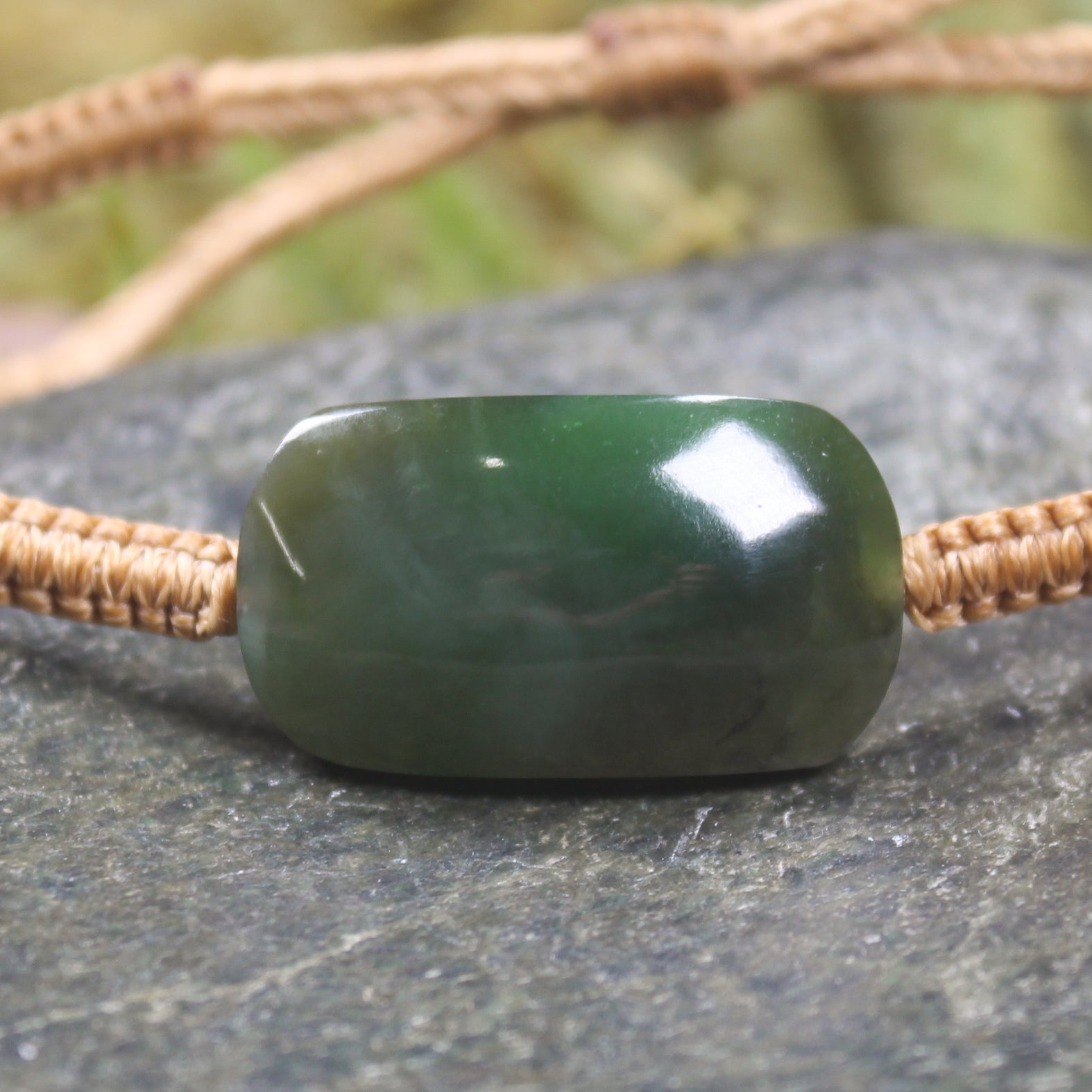 Adjustable cord bracelet with Kawakawa Pounamu
