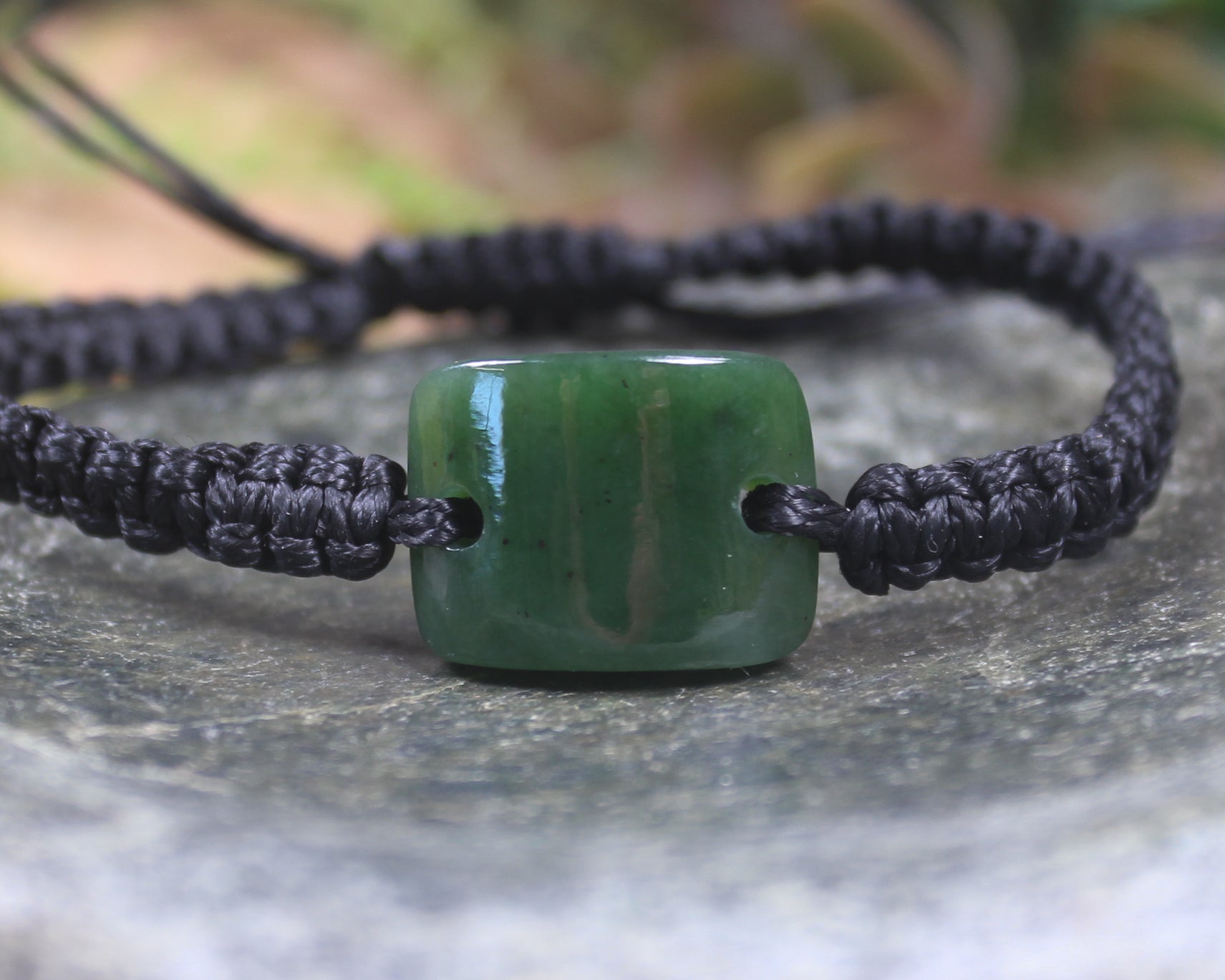 Adjustable cord bracelet with Kawakawa Pounamu