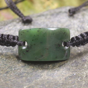 Adjustable cord bracelet with Hapopo Pounamu