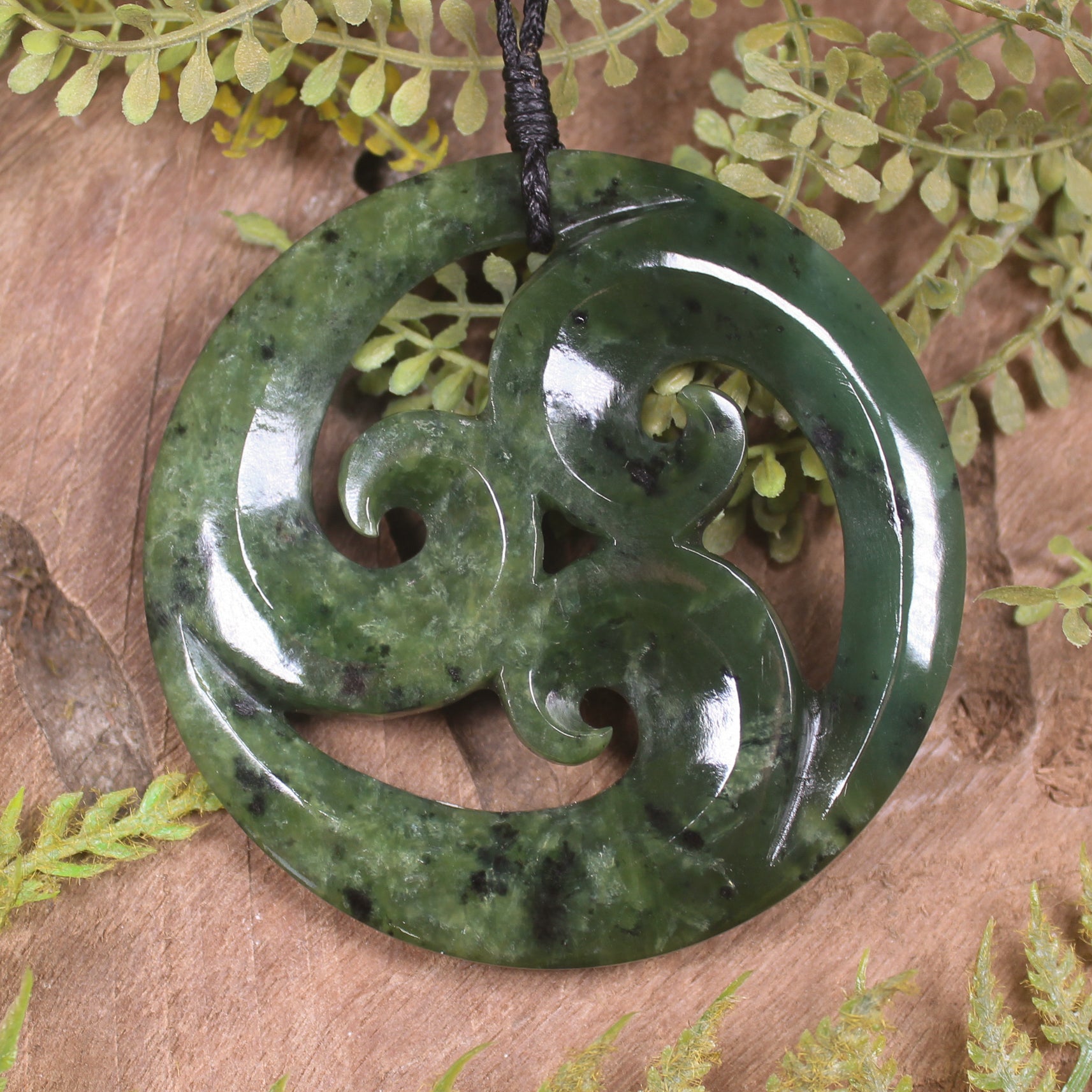 Koru pendant carved from Rimu Pounamu - NZ Greenstone