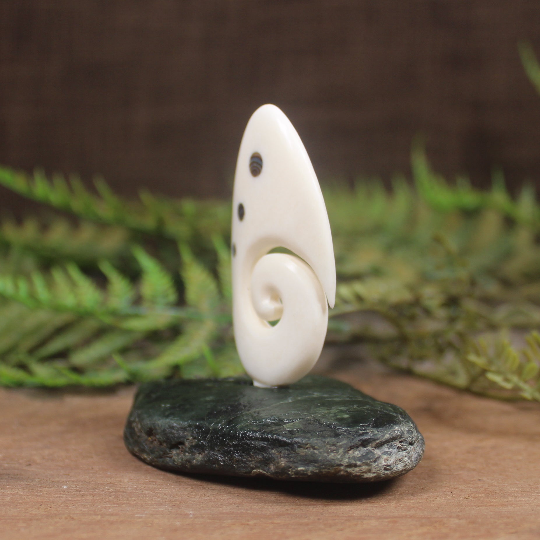 Bone Koru sculpture 