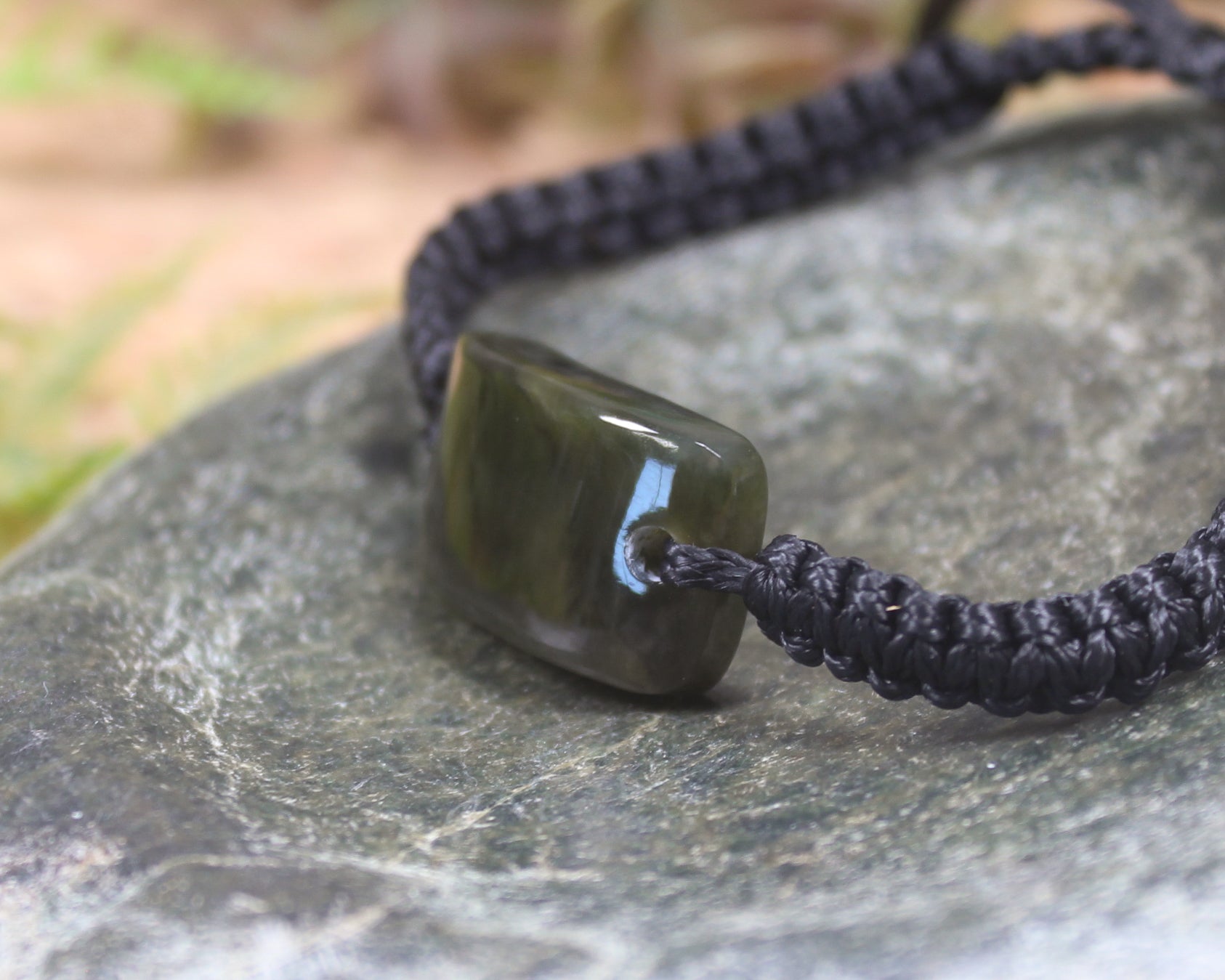 Adjustable cord bracelet with Rimu Pounamu