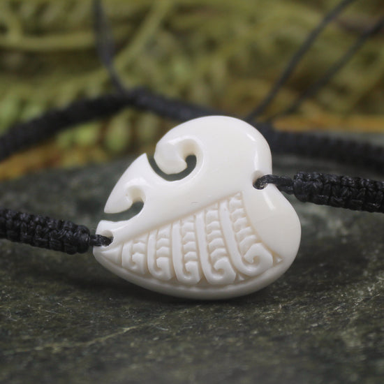 Adjustable cord bracelet with bone pendant