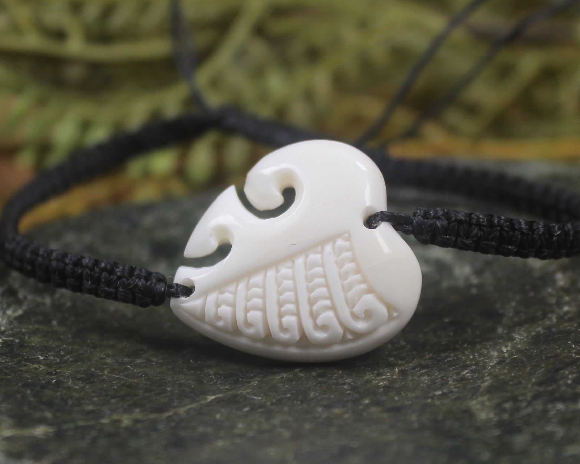 Adjustable cord bracelet with bone pendant