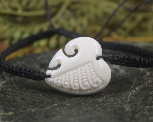 Adjustable cord bracelet with bone pendant
