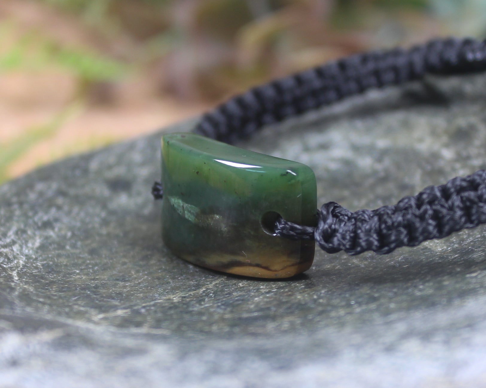 Adjustable cord bracelet with Kawakawa Pounamu