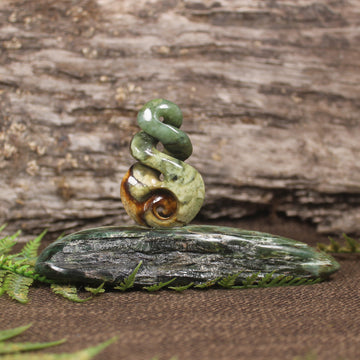 Flower Jade Pounamu Koru Twist set on a Pounamu base - NZ Greenstone