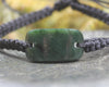 Adjustable cord bracelet with Kawakawa Pounamu
