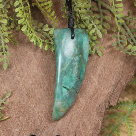 Tooth pendant carved from Fuchsite