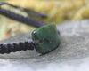 Adjustable cord bracelet with Kawakawa Pounamu