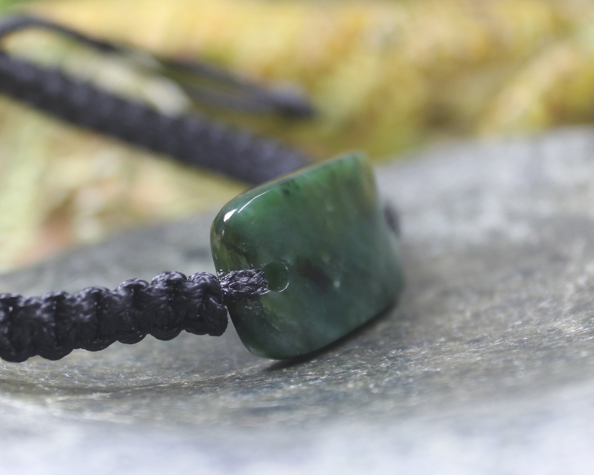 Adjustable cord bracelet with Kawakawa Pounamu