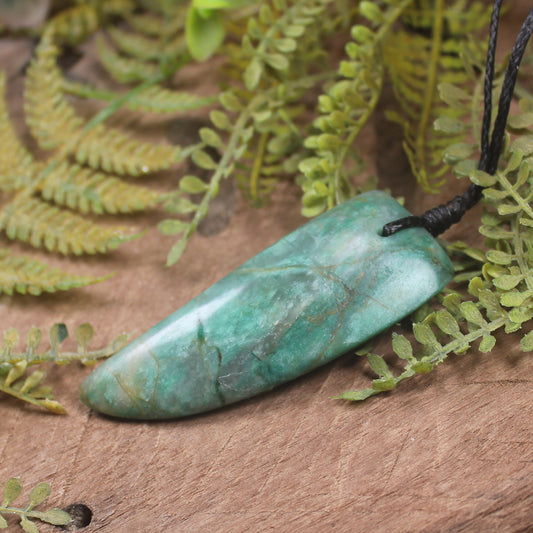 Tooth pendant carved from Fuchsite