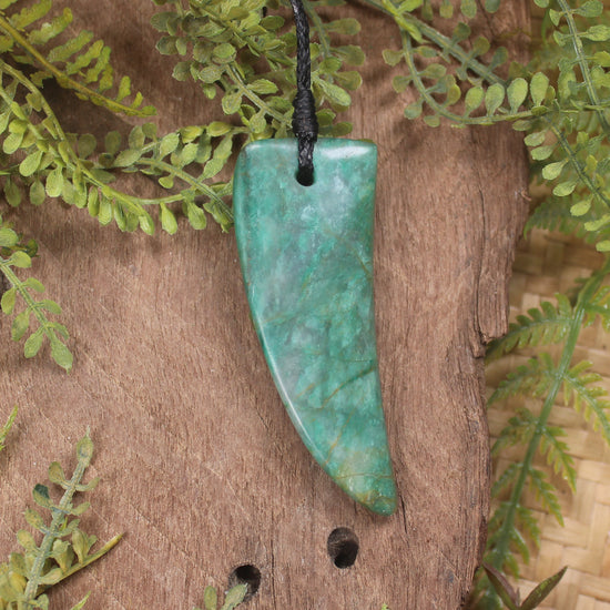 Tooth pendant carved from Fuchsite