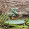 Flower Jade Pounamu Koru Twist set on a Pounamu base - NZ Greenstone