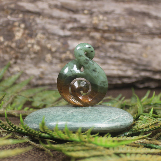 Flower Jade Pounamu Koru Twist set on a Pounamu base - NZ Greenstone