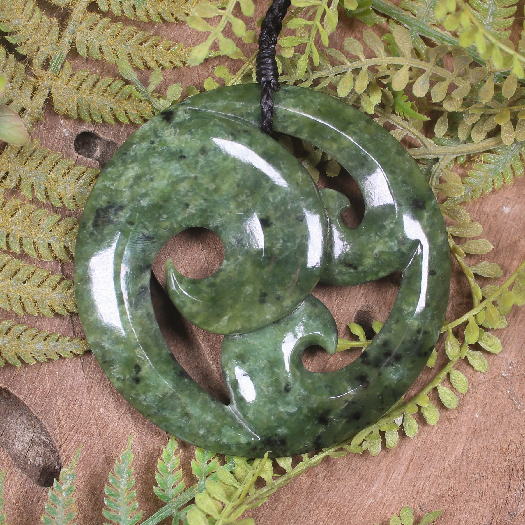Koru pendant carved from Rimu Pounamu - NZ Greenstone