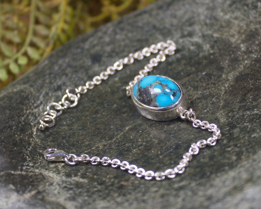 Turquoise set in a Sterling Silver chain bracelet