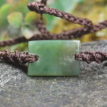 Adjustable cord bracelet with Hapopo Pounamu