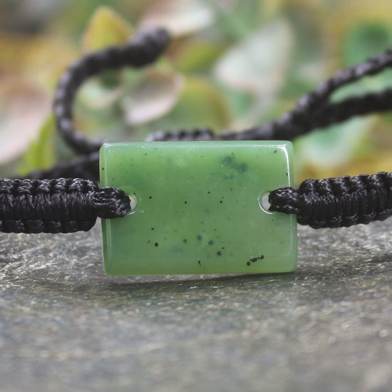 Adjustable cord bracelet with Hapopo Pounamu