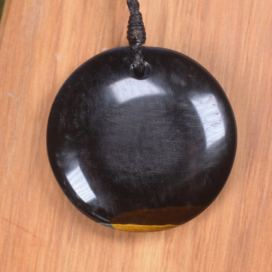 Porowhita carved from Blue Tigers Eye