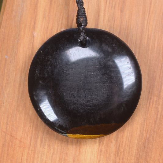 Porowhita carved from Blue Tigers Eye