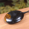 Porowhita carved from Blue Tigers Eye