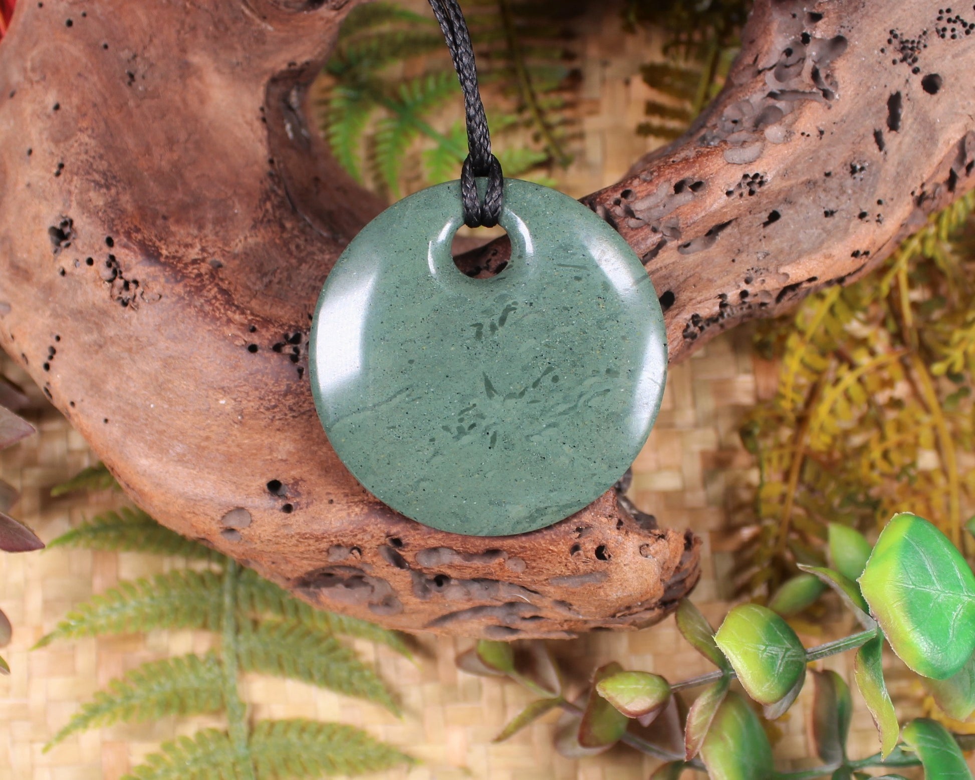 Porowhita or Pi Stone carved from NZ Pakohe or Argillite