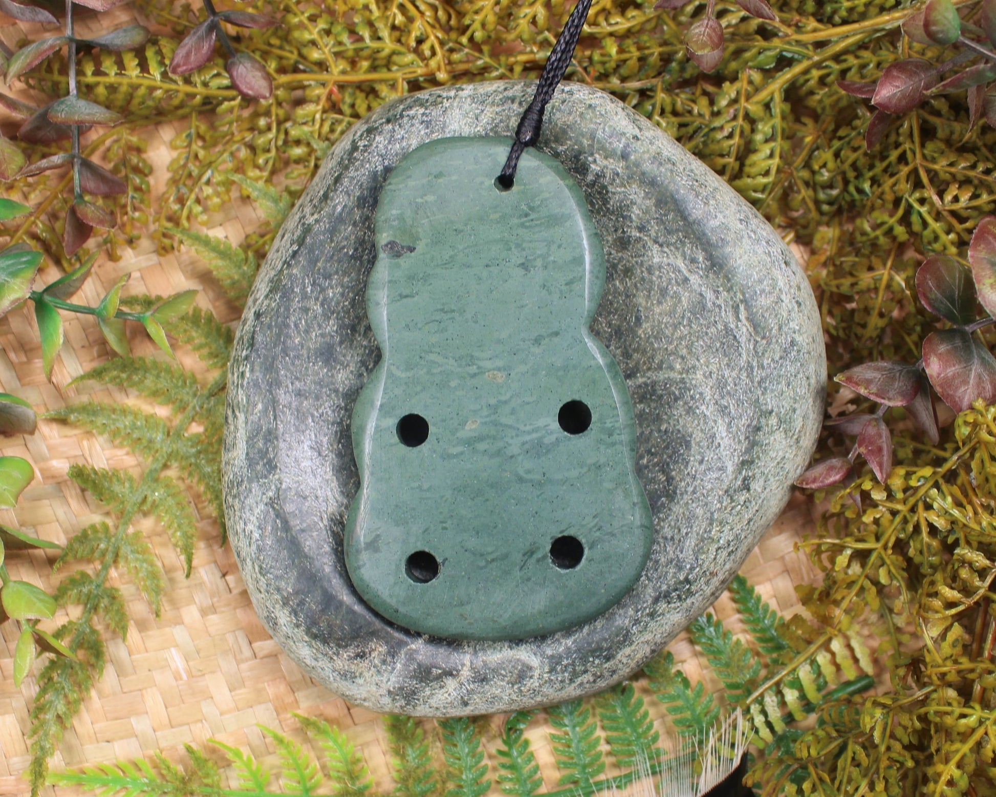 Hei Tiki carved from NZ Pakohe or Argillate