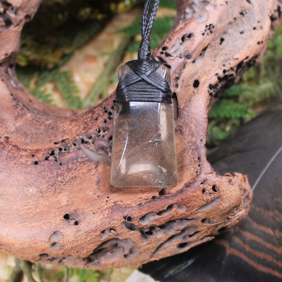 Toki pendant carved from Smokey Quartz