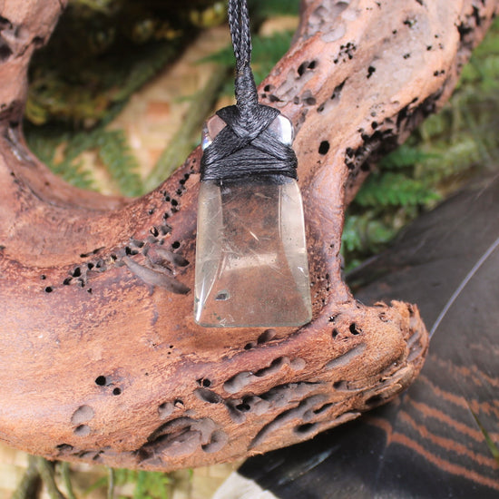 Toki pendant carved from Smokey Quartz