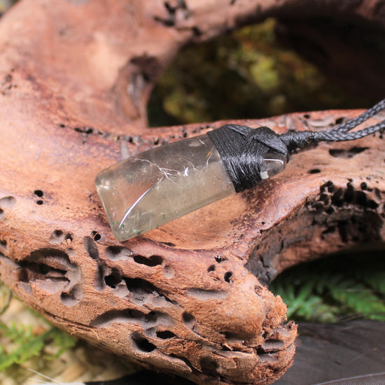Toki pendant carved from Smokey Quartz