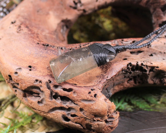 Toki pendant carved from Smokey Quartz