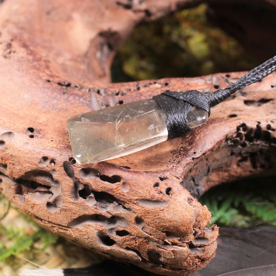 Toki pendant carved from Smokey Quartz