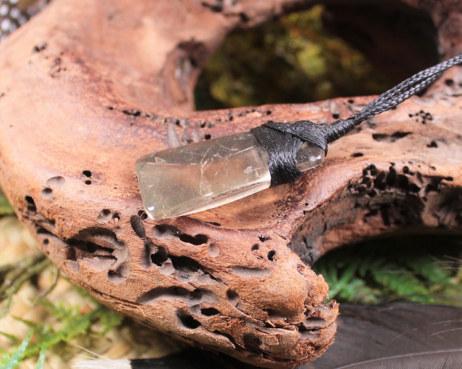 Toki pendant carved from Smokey Quartz