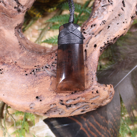 Toki pendant carved from Smokey Quartz