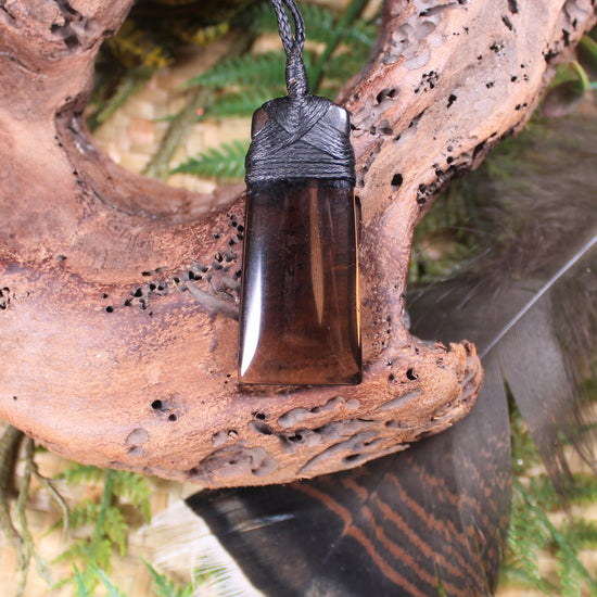 Toki pendant carved from Smokey Quartz