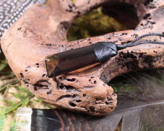 Toki pendant carved from Smokey Quartz