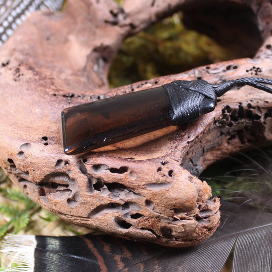 Toki pendant carved from Smokey Quartz