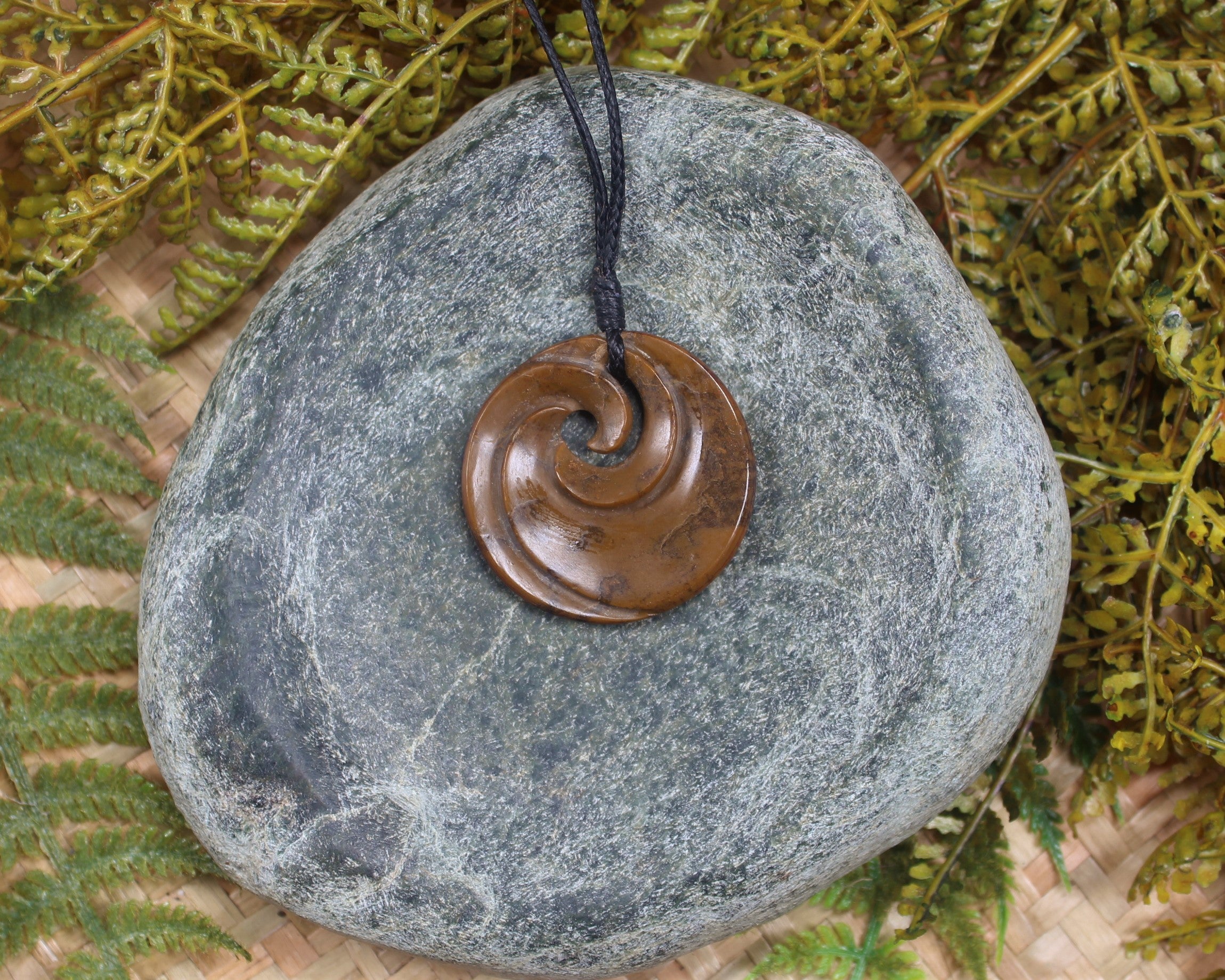 Koru or Spiral carved from NZ Fossilised Wood