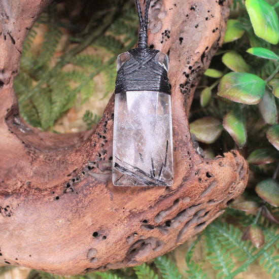 Clear Quartz with Black Tourmaline carved into a Toki or Adze