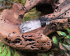 Clear Quartz with Black Tourmaline carved into a Toki or Adze