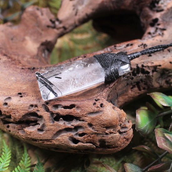 Clear Quartz with Black Tourmaline carved into a Toki or Adze