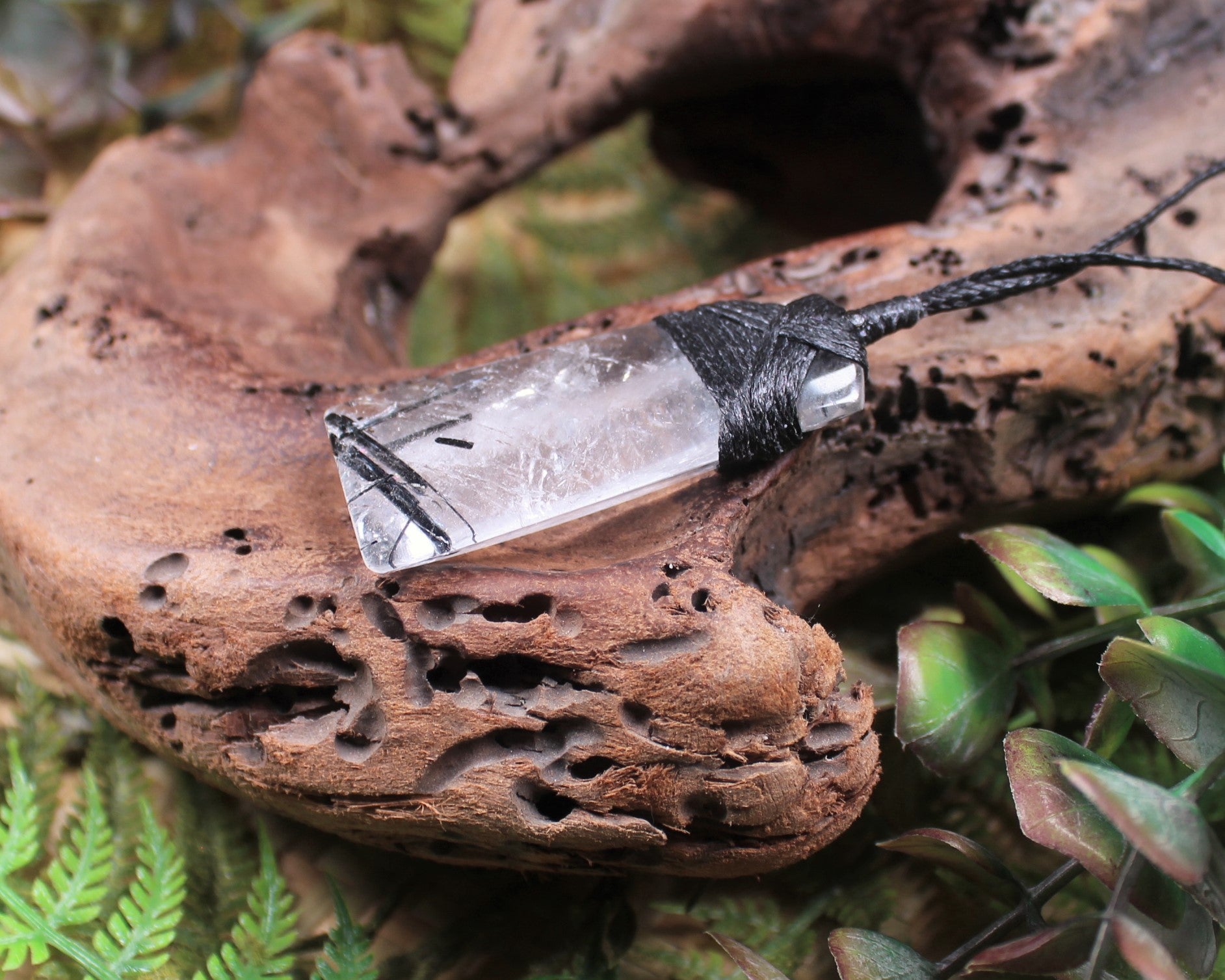 Clear Quartz with Black Tourmaline carved into a Toki or Adze