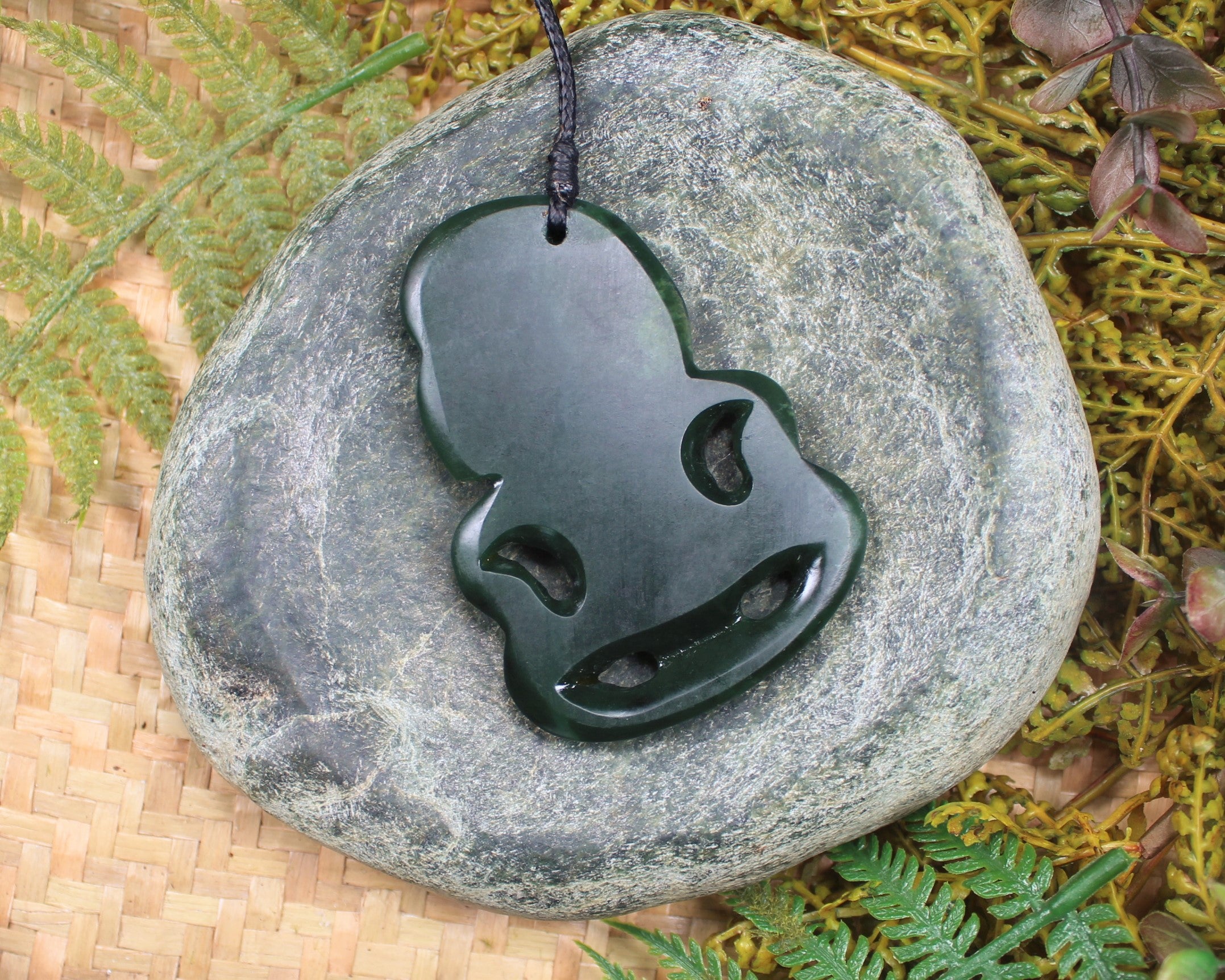 Hei Tiki Pendant carved from Flower Jade Pounamu